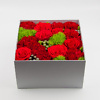 Red flowers in a box flower delivery service in Vilnius Beatričės Gėlių Namai