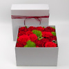 Red flowers in a box flower delivery service in Vilnius Beatričės Gėlių Namai
