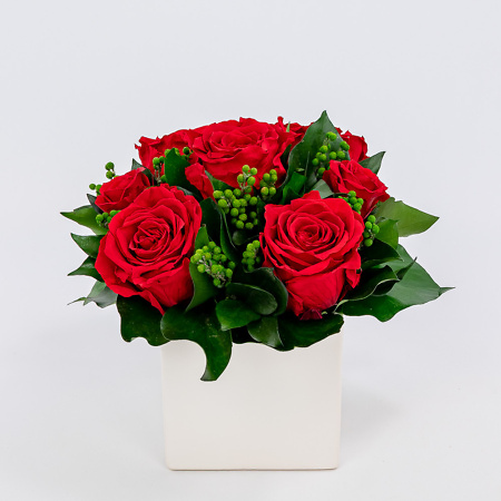 Arrangement with red preserved roses
